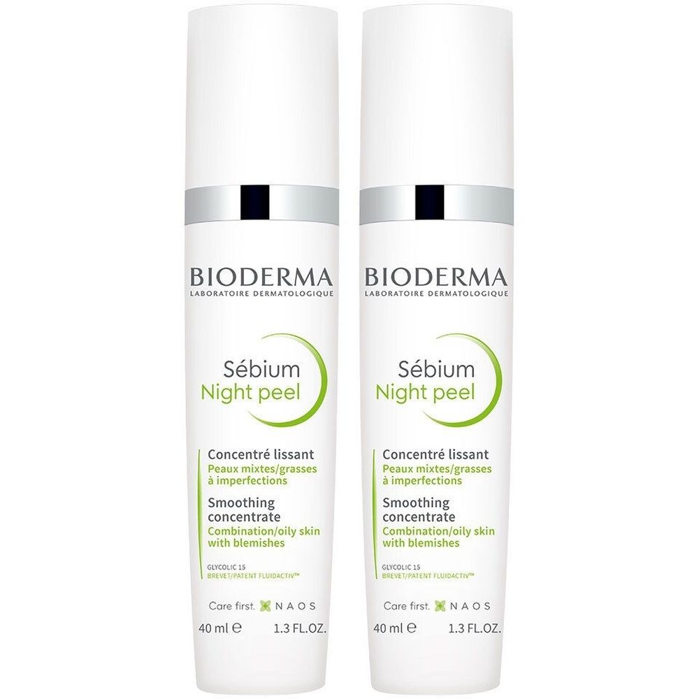 Deux flacons blancs avec bagues argentées et bouchons noirs. Inscription: BIODERMA, Sébium Night peel.