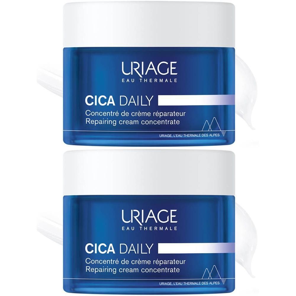 Deux pots bleus Uriage Cica Daily. Inscription: Cica Daily, Concentré de crème réparateur, Repairing cream concentrate.