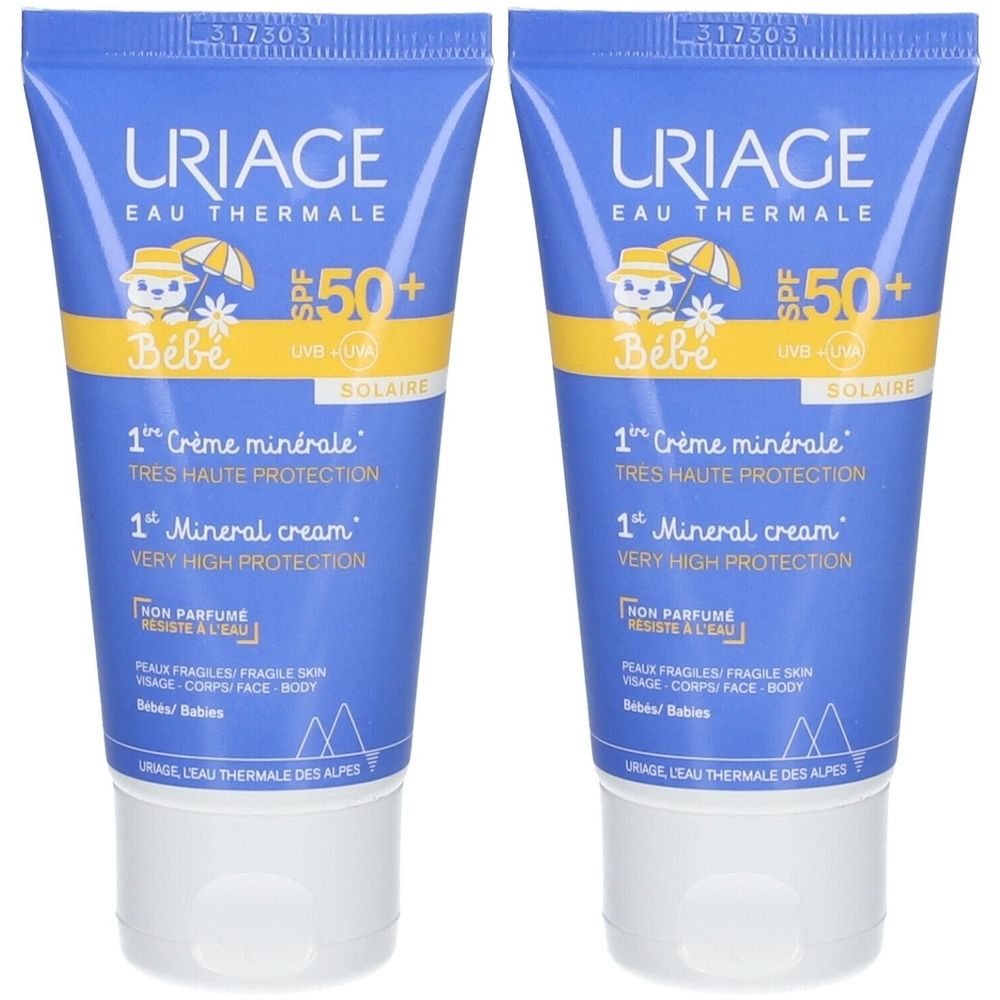 Twee tubes Uriage Bébé Mineral-Creme SPF50+. Blauwe tube met gele accenten. Bevat zonnebrandcrème voor baby's.