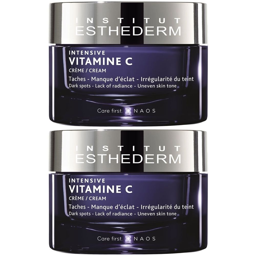Twee potjes Institut Esthederm Intensive Vitamine C Crème. Donkerblauwe pot met zilveren deksel. Tekst: Intensive Vitamine C Crème.