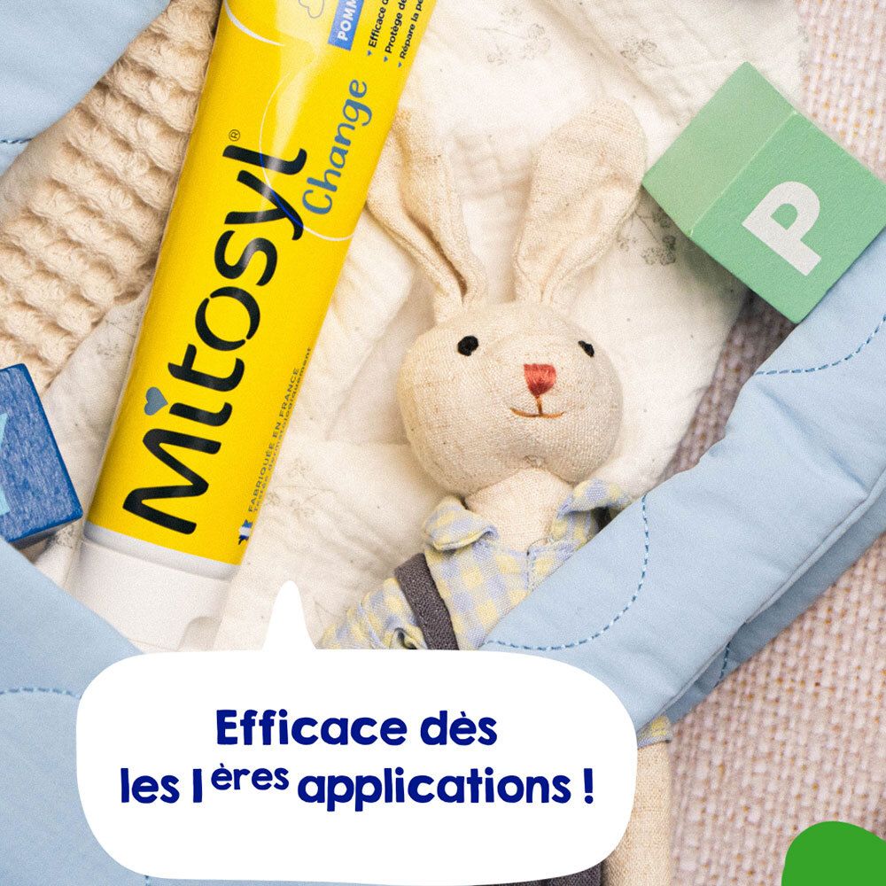 Gele tube Mitosyl Change, Pommade Protectrice, naast speelgoed. Tekst: Efficace dès les 1ères applications!