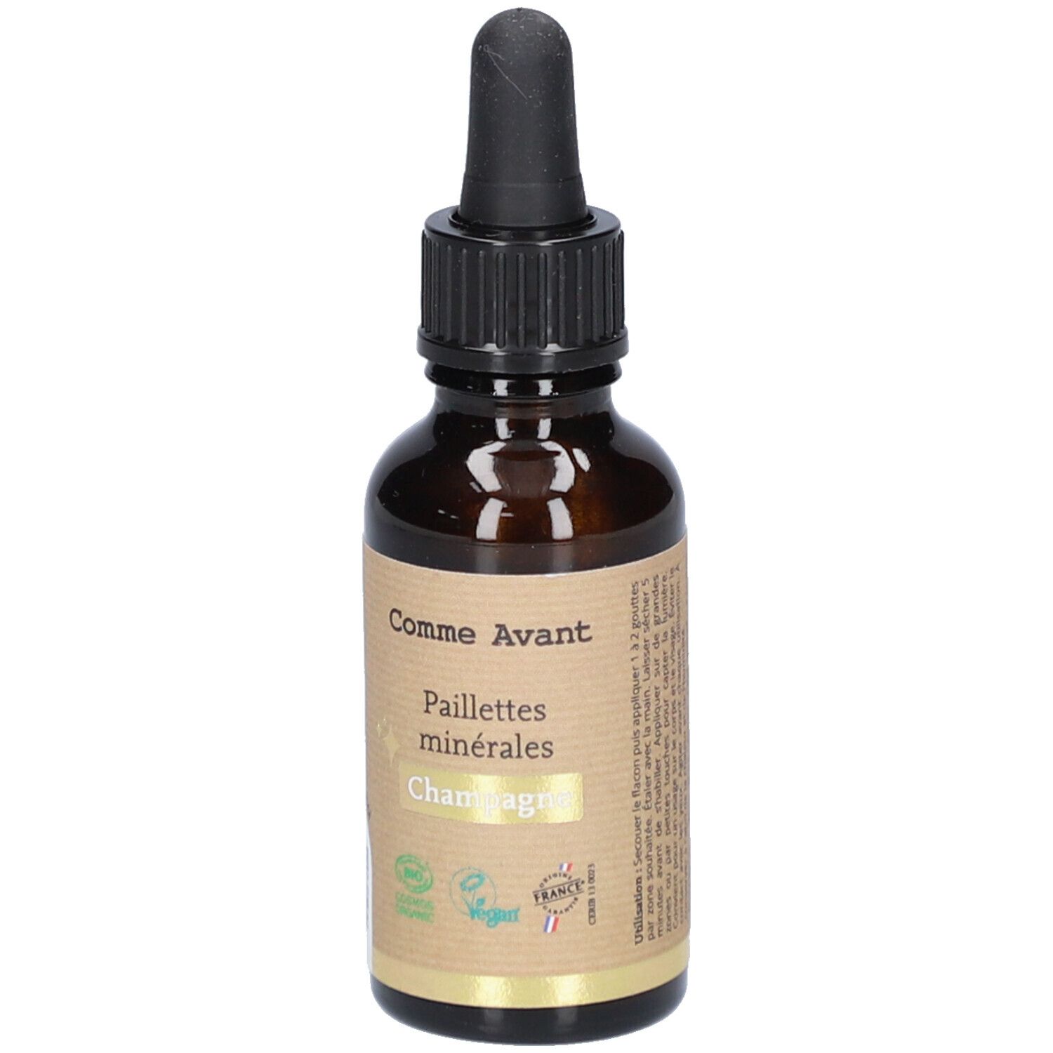 Bruine glazen fles met zwarte druppelaar. Etiket met productnaam en logo. Vegan- en bio-keurmerken.