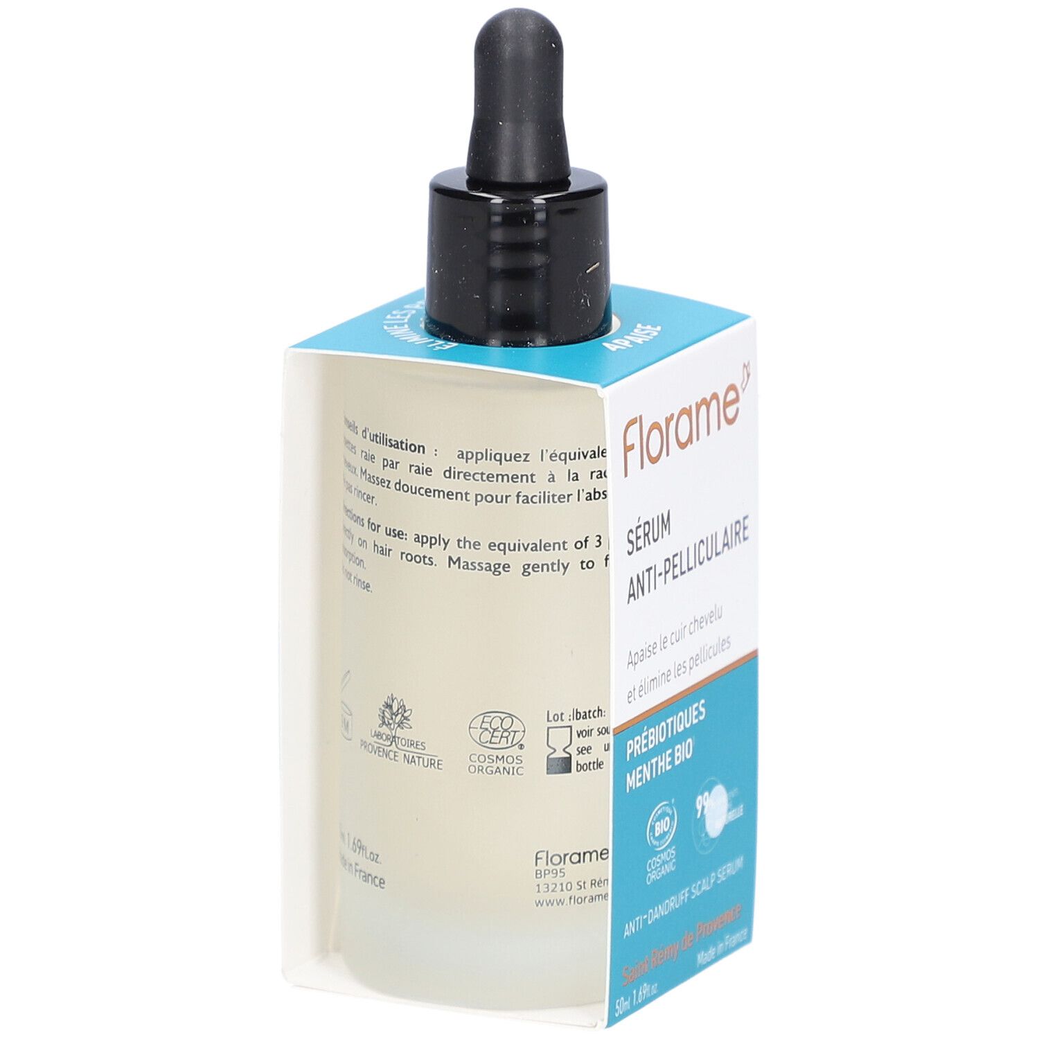 Achterkant van serumfles in verpakking. Tekst: gebruiksaanwijzing, ingrediënten, logo's. Fles met zwarte druppelaar.