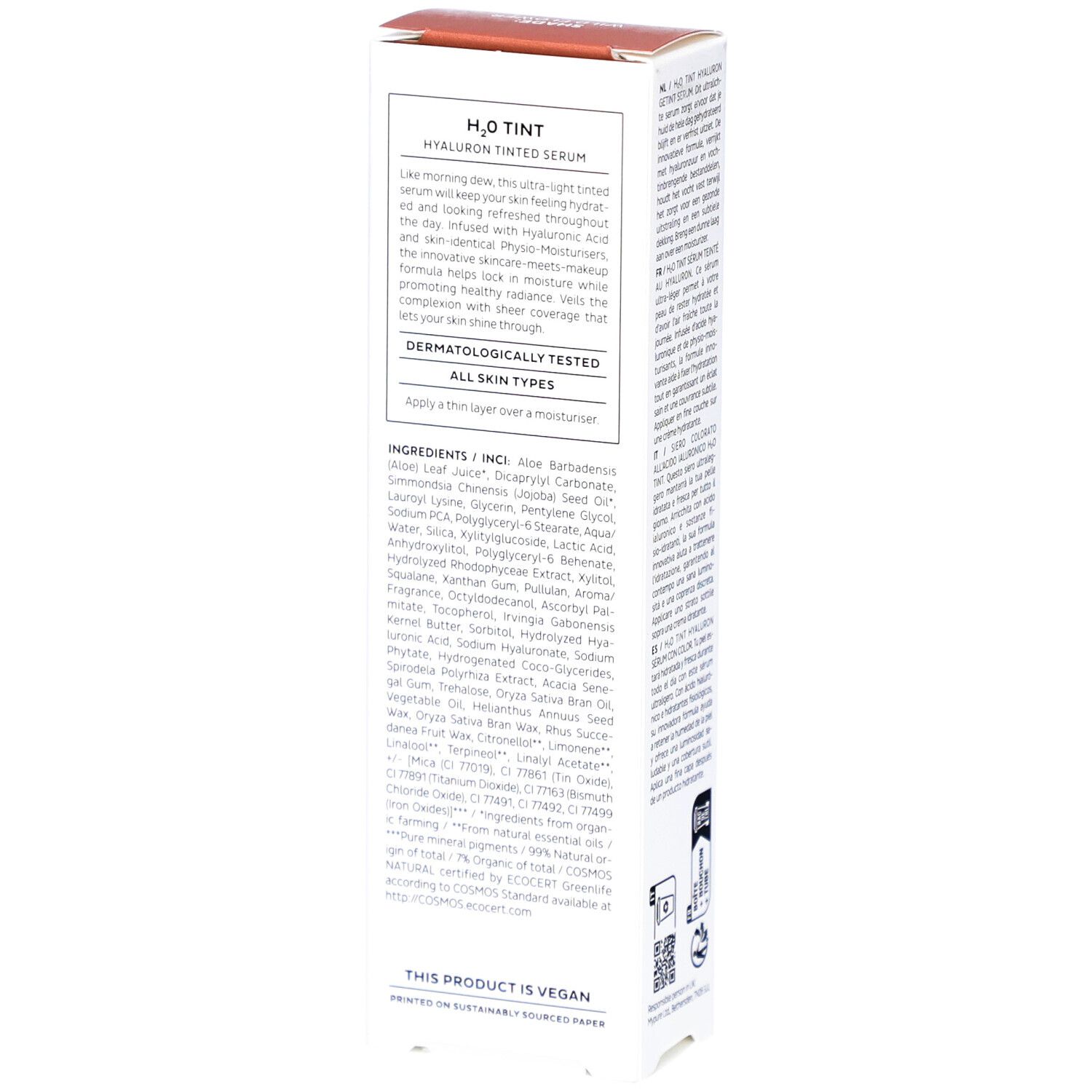 Witte doos, achterkant. Tekst met ingrediënten en gebruiksaanwijzingen. Opdruk: Dermatologisch getest, Veganistisch.