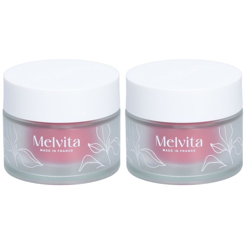 Twee potten met witte deksels. De tekst "Melvita" en "Made in France" zijn zichtbaar.