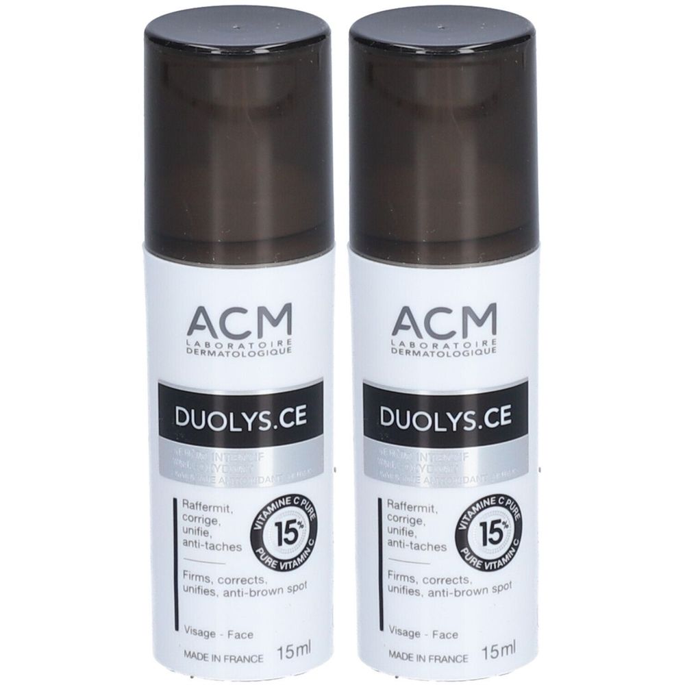 Twee witte flacons met zwarte dop. Opschrift: ACM, DUOLYS.CE, 15% vitamine C. Franse tekst. 15ml.