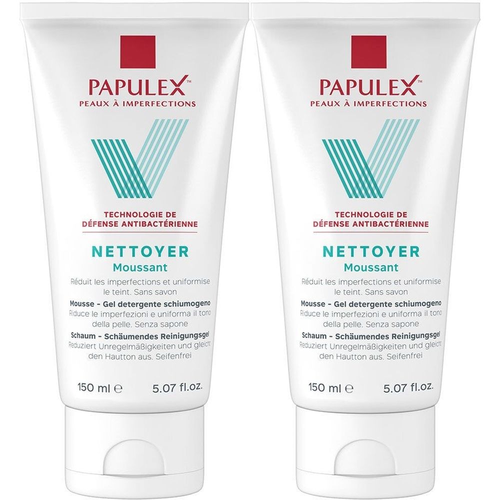 Twee witte tubes met rood en blauw logo. Opschrift: NETTOYER Moussant. 150 ml.