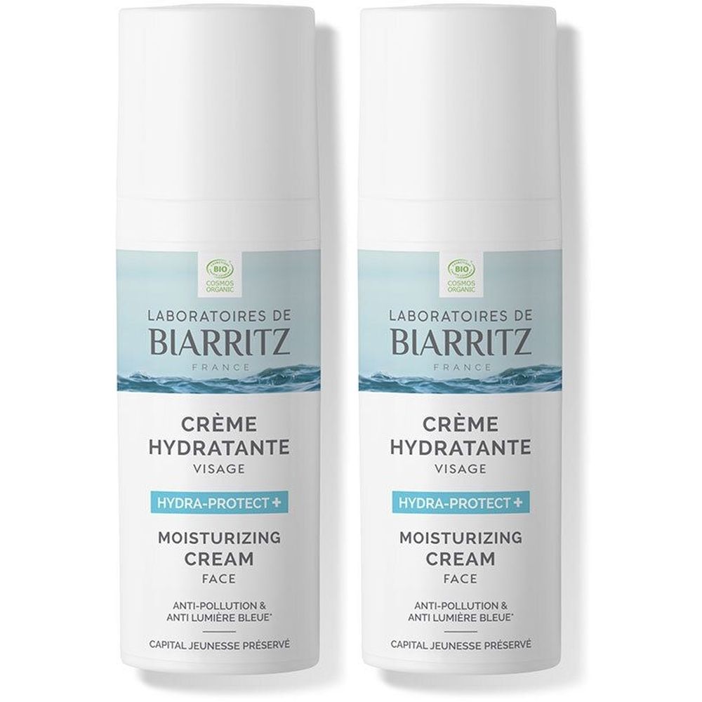 Deux flacons blancs avec étiquettes bleues. Inscription: LABORATOIRES DE BIARRITZ, Crème Hydratante Visage, Moisturizing Cream.