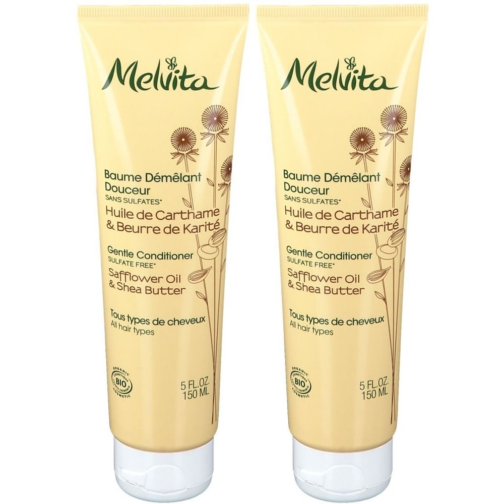 Twee tubes Melvita conditioner. Beige tubes met witte dop. Opschrift: Baume Démêlant Douceur, Safflower Oil & Shea Butter.