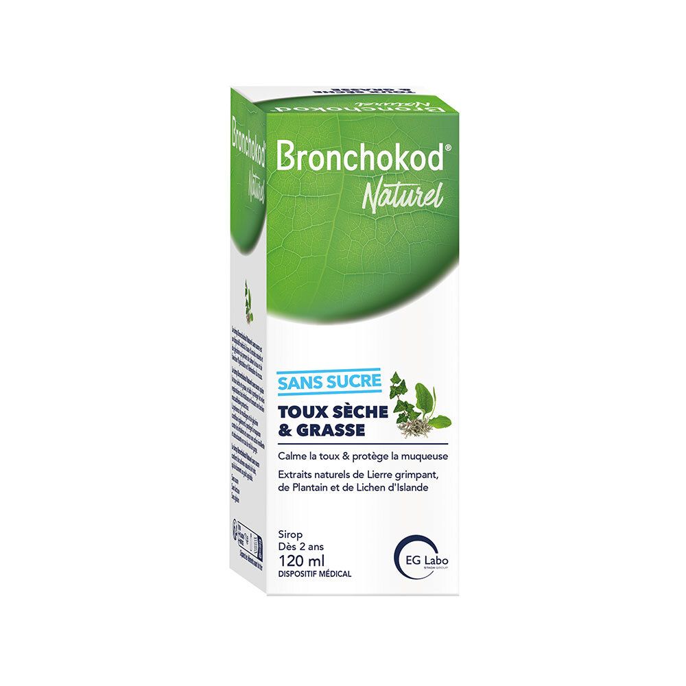 Witte doos met productnaam en tekst. Groene blad vorm. Doos staat.