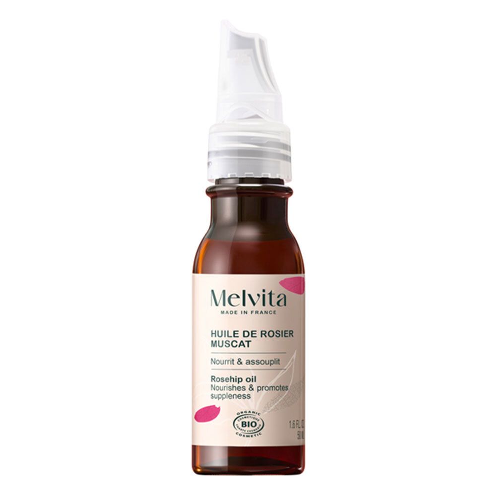 Bruine glazen fles met witte applicator. Opschrift: Melvita, Huile de Rosier Muscat, Rosehip oil, Bio-certificering.