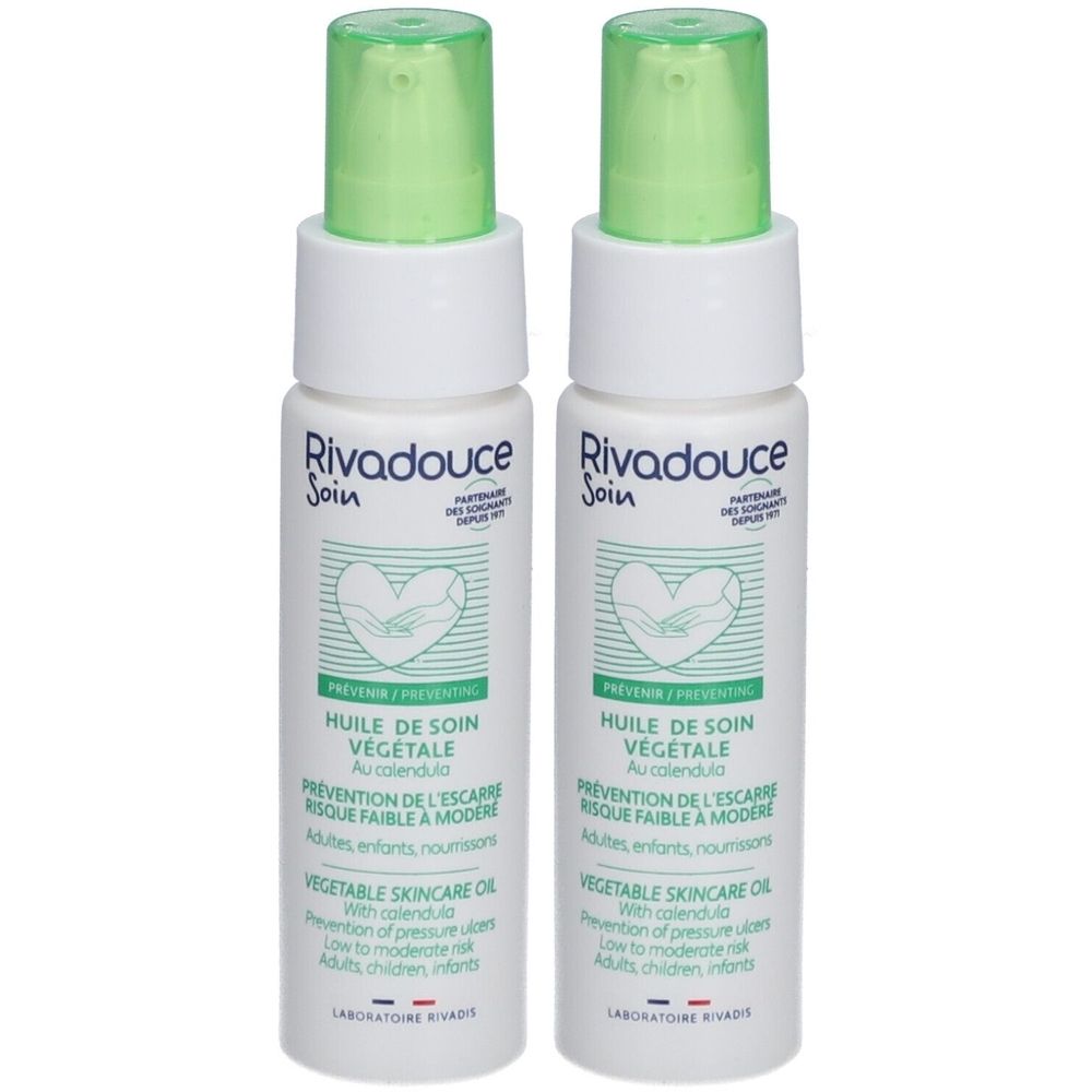Deux flacons de Rivadouce Huile De Soin Végétale. Flacons blancs avec vaporisateur vert. Texte: Huile de Soin Végétale, prévention des escarres.