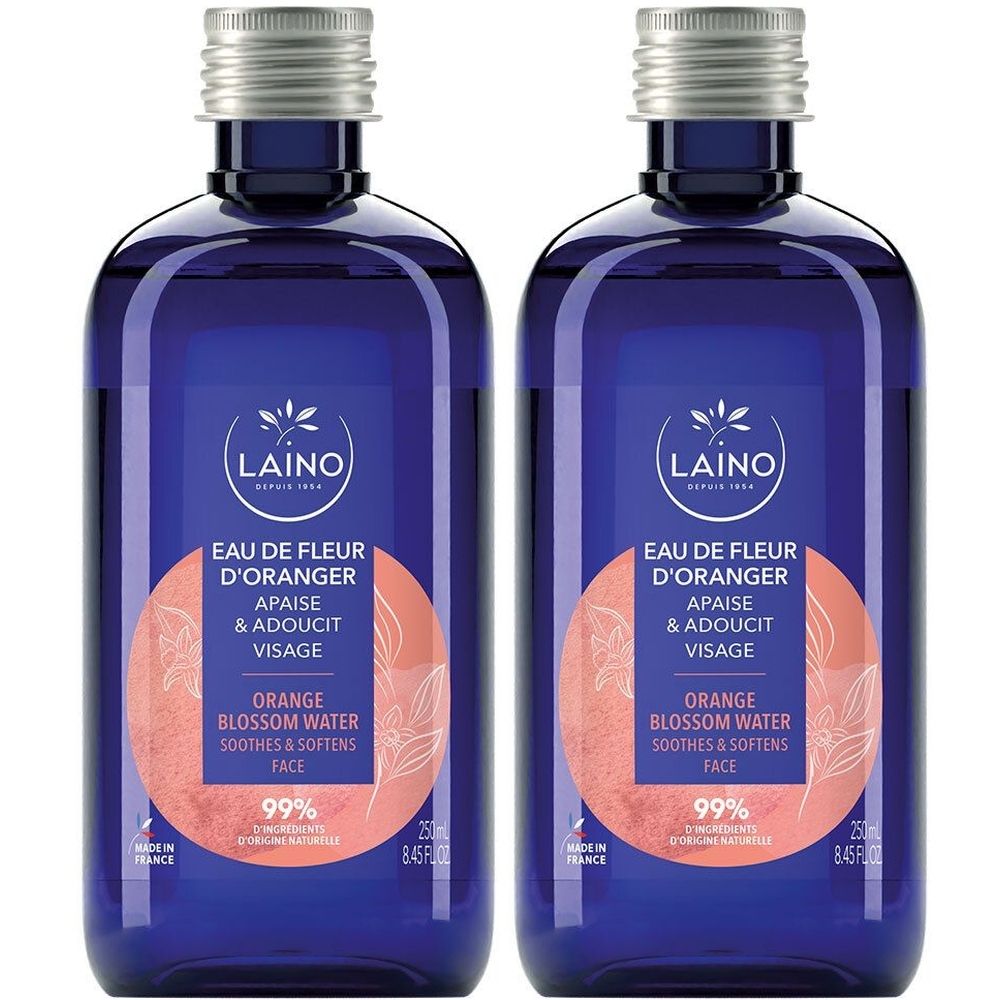 Deux flacons bleus avec bouchons argentés. Inscription : LAINO Eau de Fleur d'Oranger, apaise et adoucit le visage. 99% d'ingrédients d'origine naturelle.