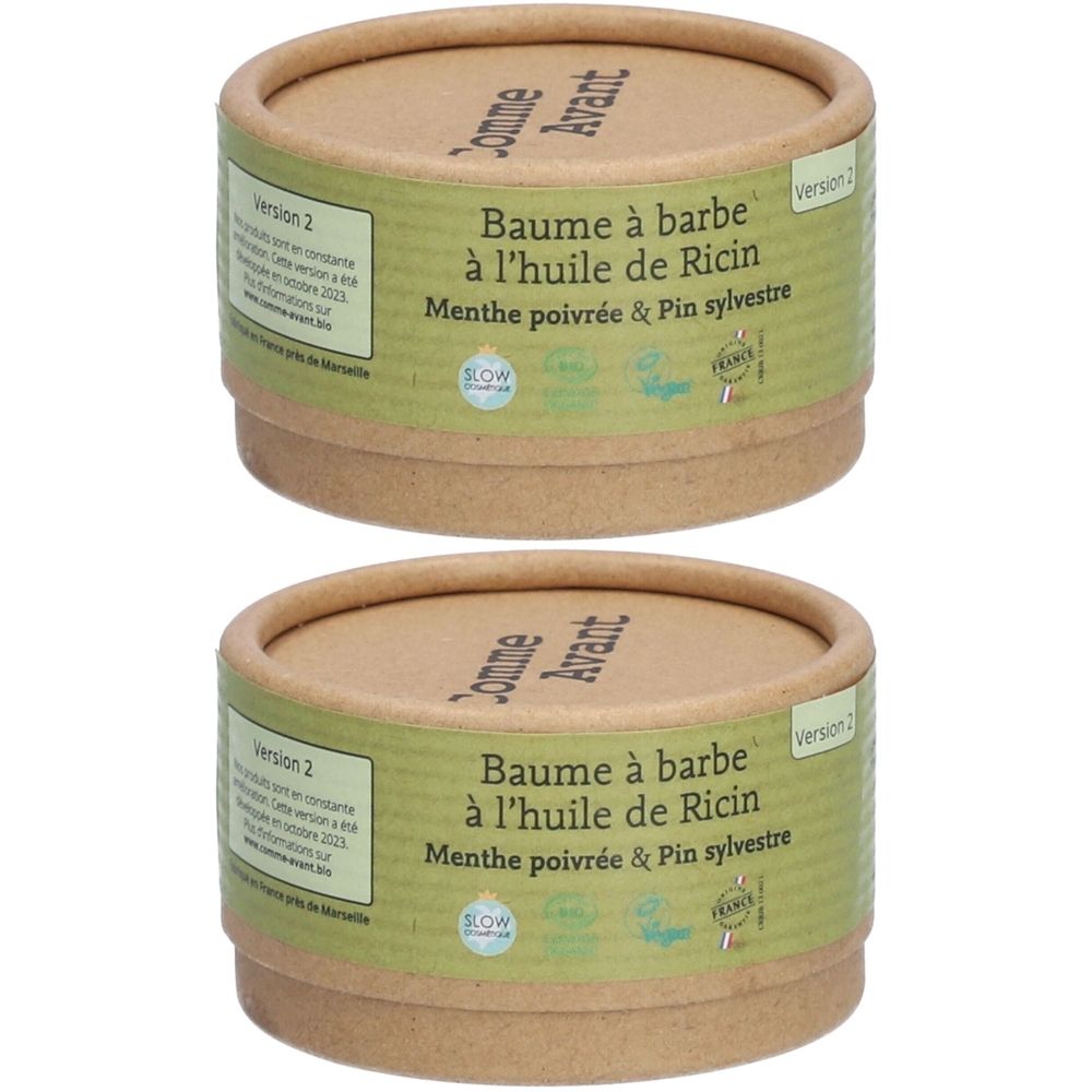 Twee cilindrische containers. Opschrift: Baume à barbe à l'huile de Ricin, Menthe poivrée & Pin sylvestre. Merk Comme Avant.
