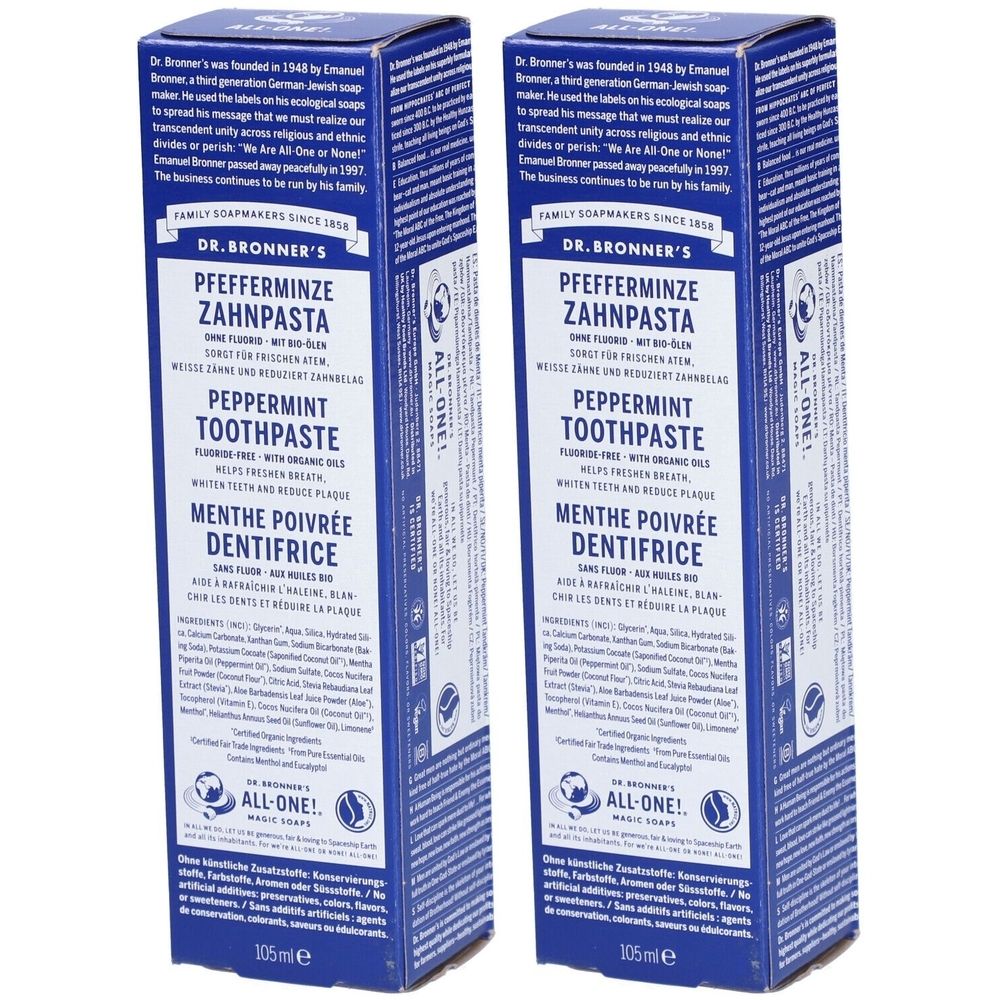 Twee blauwe dozen met "Pfefferminze Zahnpasta". Tekst in het Duits, Engels en Frans. Merk: DR. BRONNER'S.