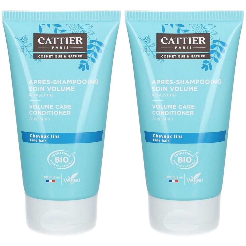 Twee blauwe tubes Cattier Après-Shampooing. Opschrift: Soin Volume, Conditioner, Cheveux fins. Bio-certificering en Vegan-keurmerk.
