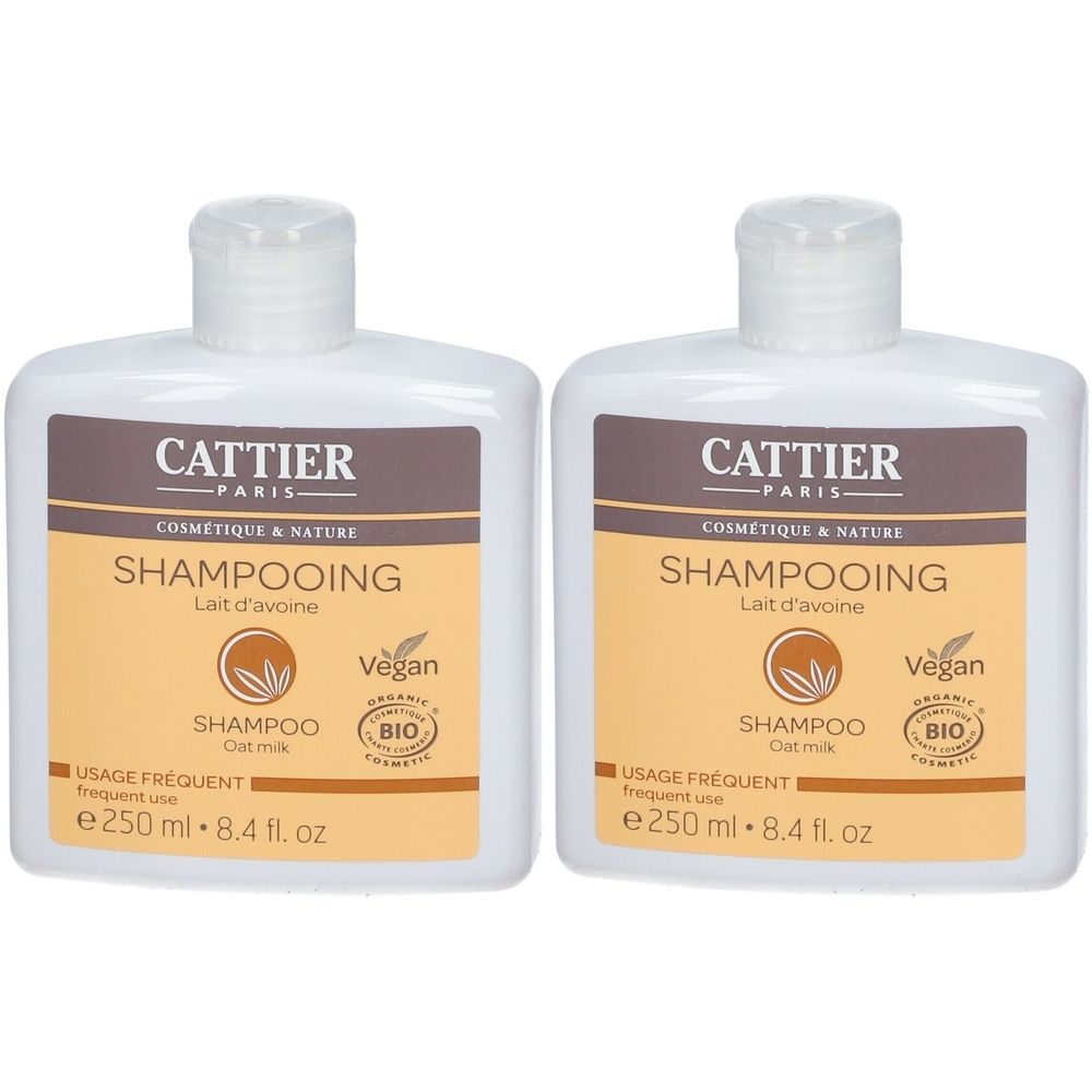 Twee witte flessen met bruine etiketten. Opschrift: CATTIER PARIS, Shampooing, Lait d'avoine, Vegan, Bio.