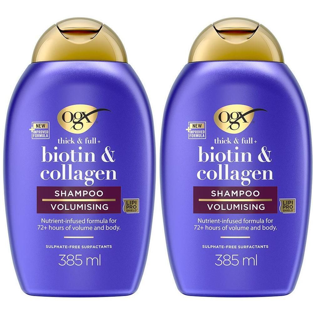 Twee flessen OGX Biotin & Collagen shampoo. Paarse flessen met gouden doppen. Tekst: Biotin & Collagen, Volumizing.