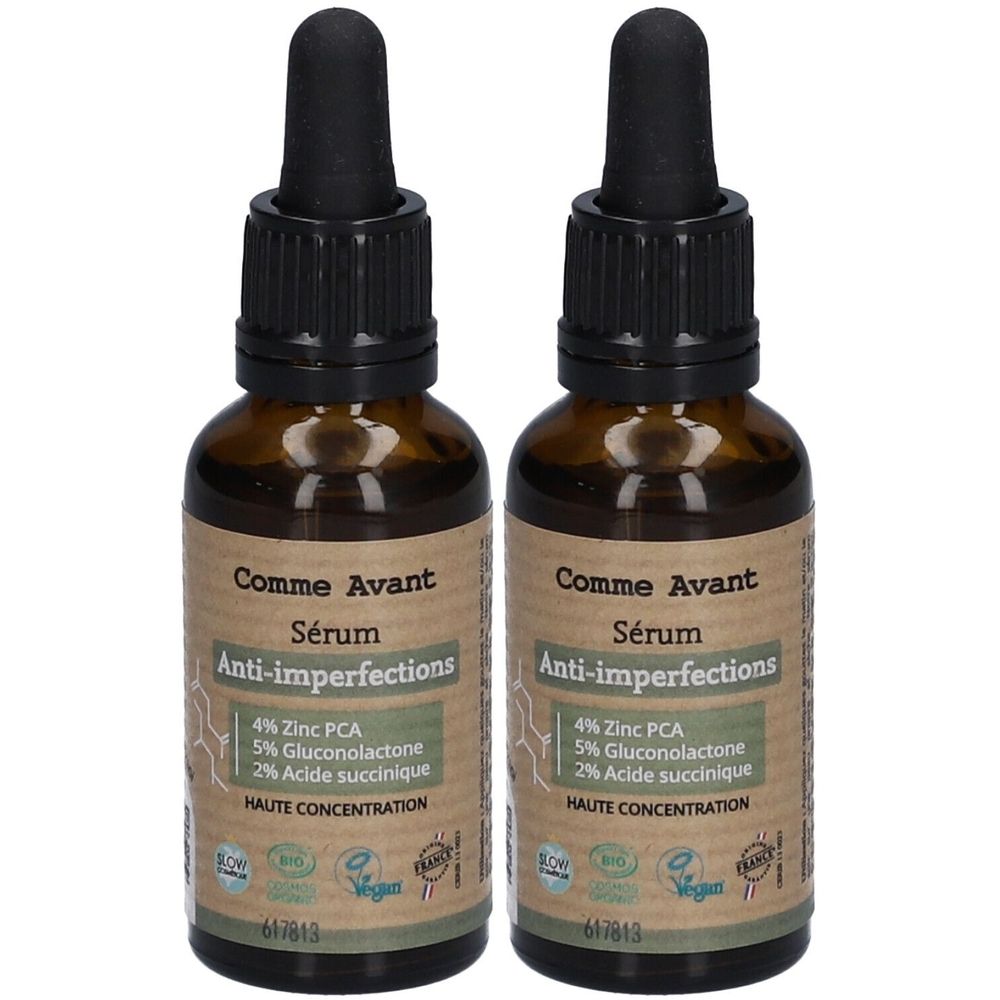 Twee bruine glazen flessen met zwarte pipetten. Labels: "Comme Avant Sérum Anti-imperfections", met ingrediënten.