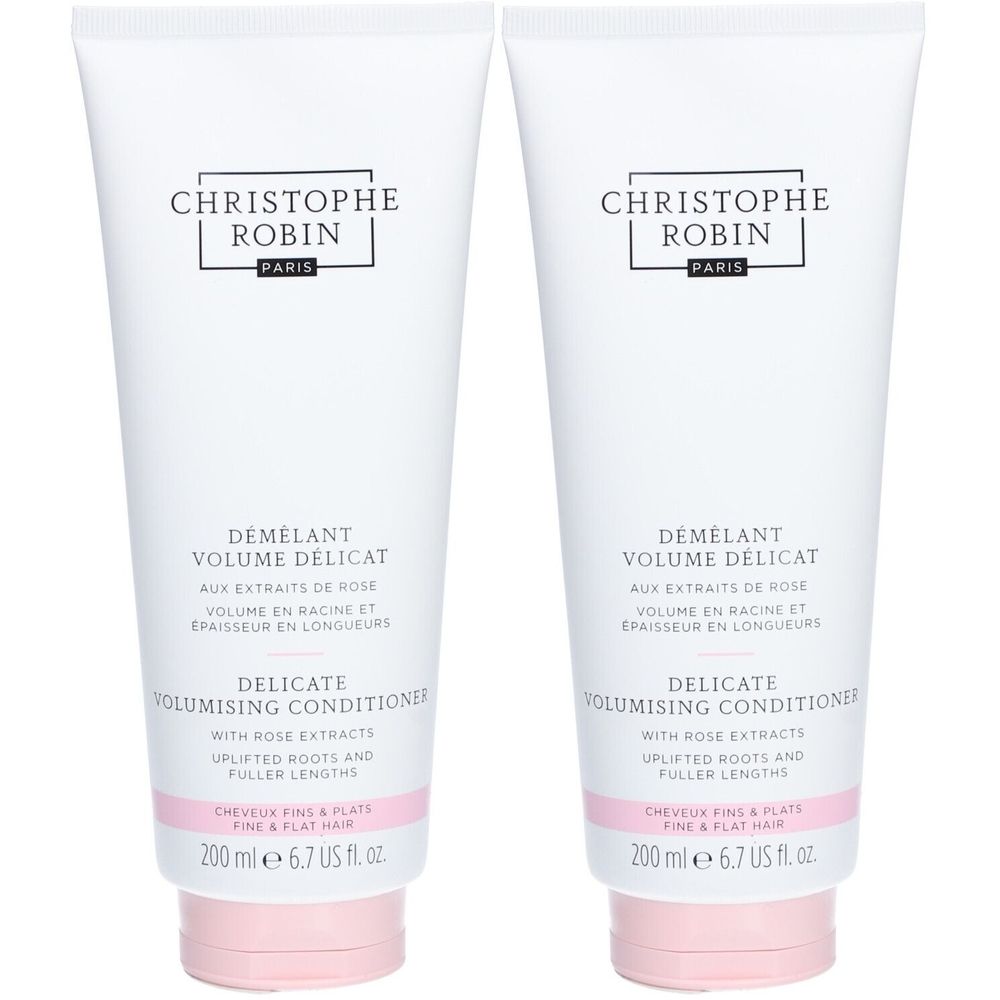 Twee witte tubes met tekst. Merk: CHRISTOPHE ROBIN. Product: DÉMÊLANT VOLUME DÉLICAT. Roze dop.