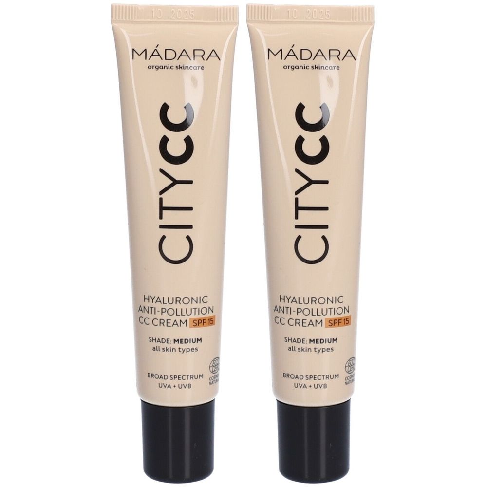 Deux tubes de crème Mádara CITY CC Anti-Pollution CC Cream SPF 15. Tubes beiges avec bouchon noir. Texte : CITY CC, Acide hyaluronique, SPF 15.