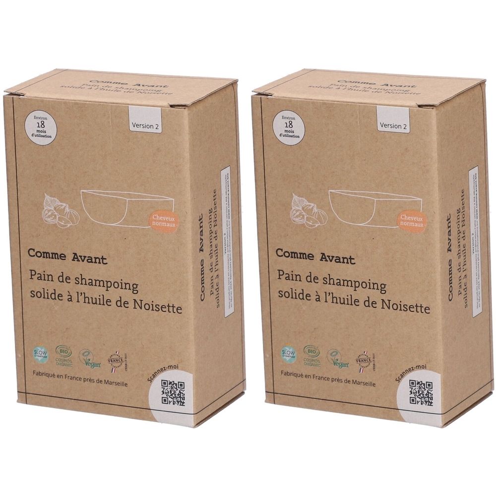 Twee kartonnen dozen. Opschrift: Comme Avant, Pain de shampoing solide à l'huile de Noisette. Logo's en QR-code.