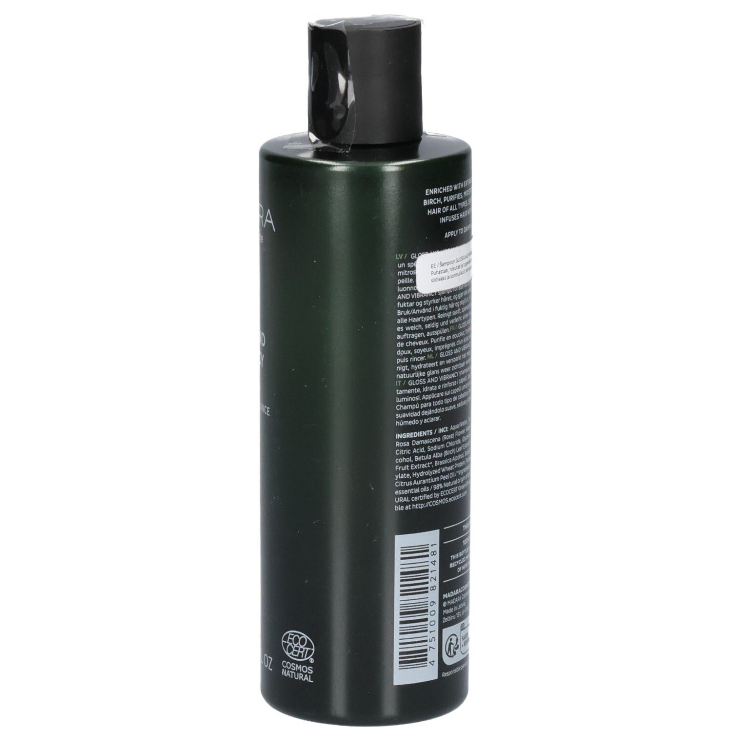 Achterkant van een groene shampoofles. Etiket bevat ingrediënten en gebruiksinstructies.