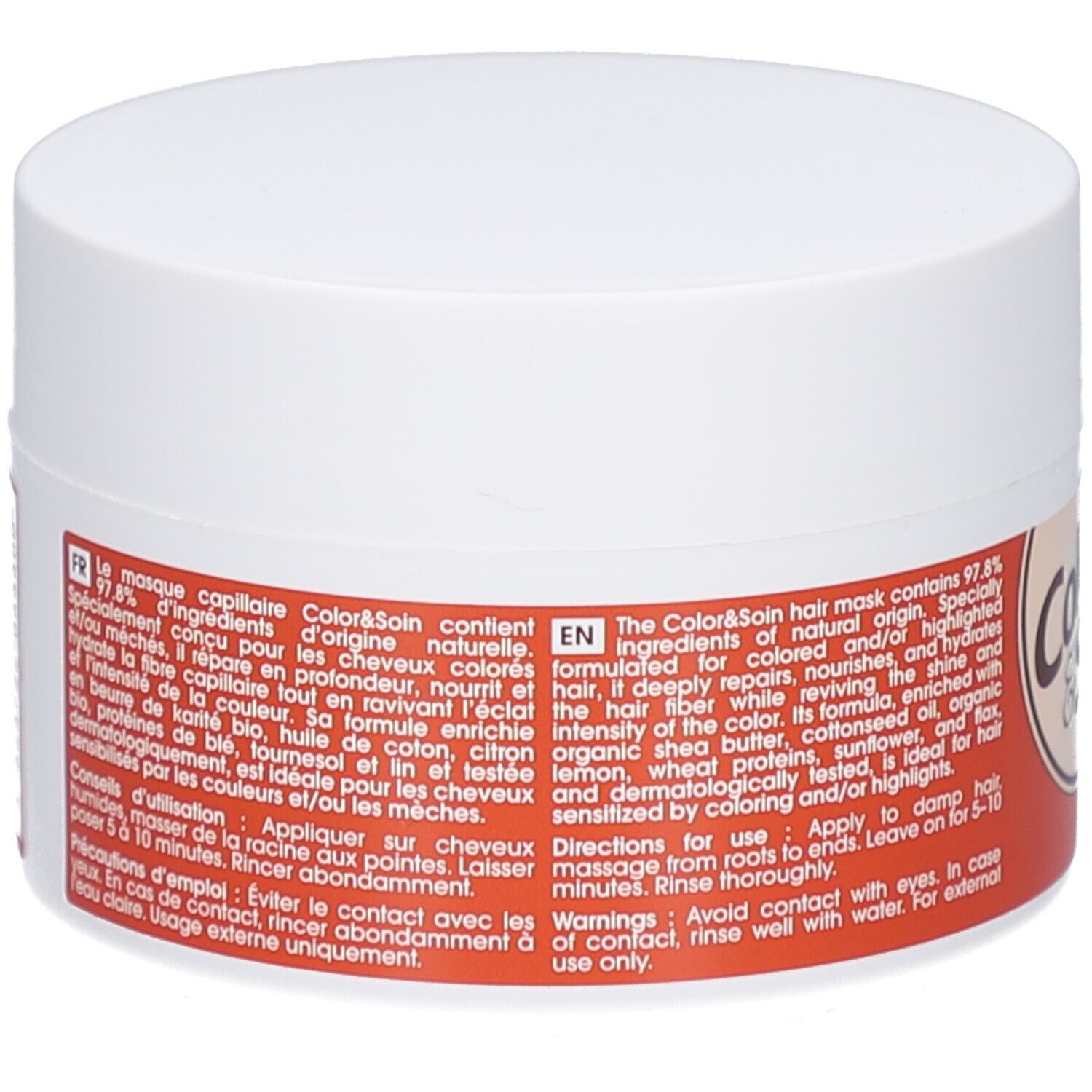 Pot rond blanc. Étiquette avec informations produit multilingues. Fond orange.