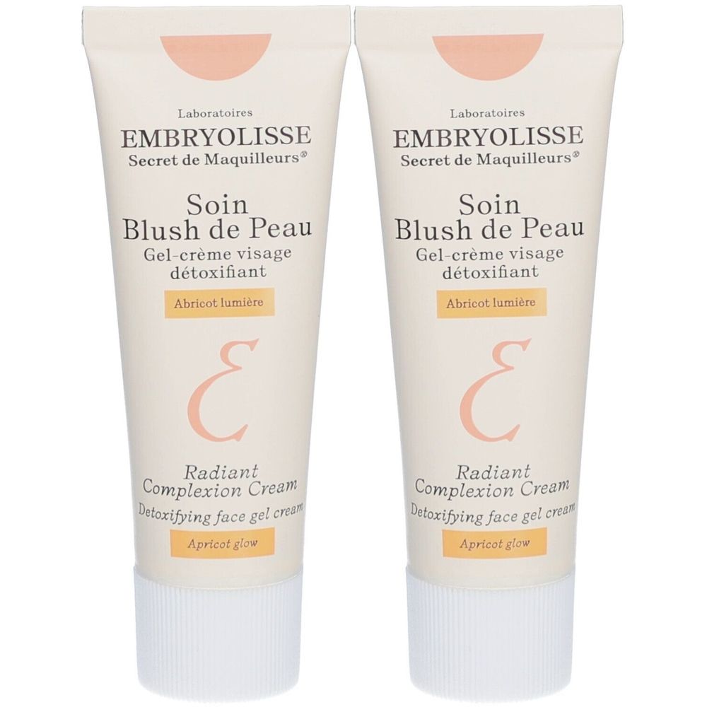 Deux tubes de Soin Blush de Peau. Tube beige avec texte et nom du produit. Bouchon à vis blanc.