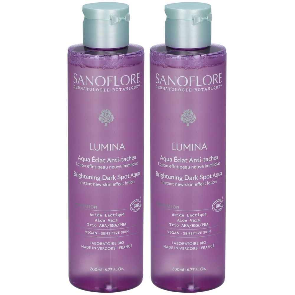 Twee flessen SANOFLORE Lumina Aqua. Paarse flessen met lichtgroene doppen. Tekst: LUMINA, Aqua Éclat Anti-taches, Brightening Dark Spot Aqua.