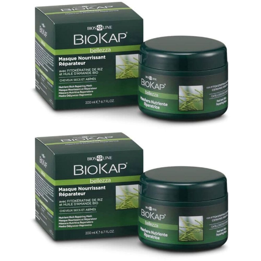 Twee groene potten en dozen. Opschrift BIOKAP. Op de dozen staat « Masque Nourrissant Réparateur ».