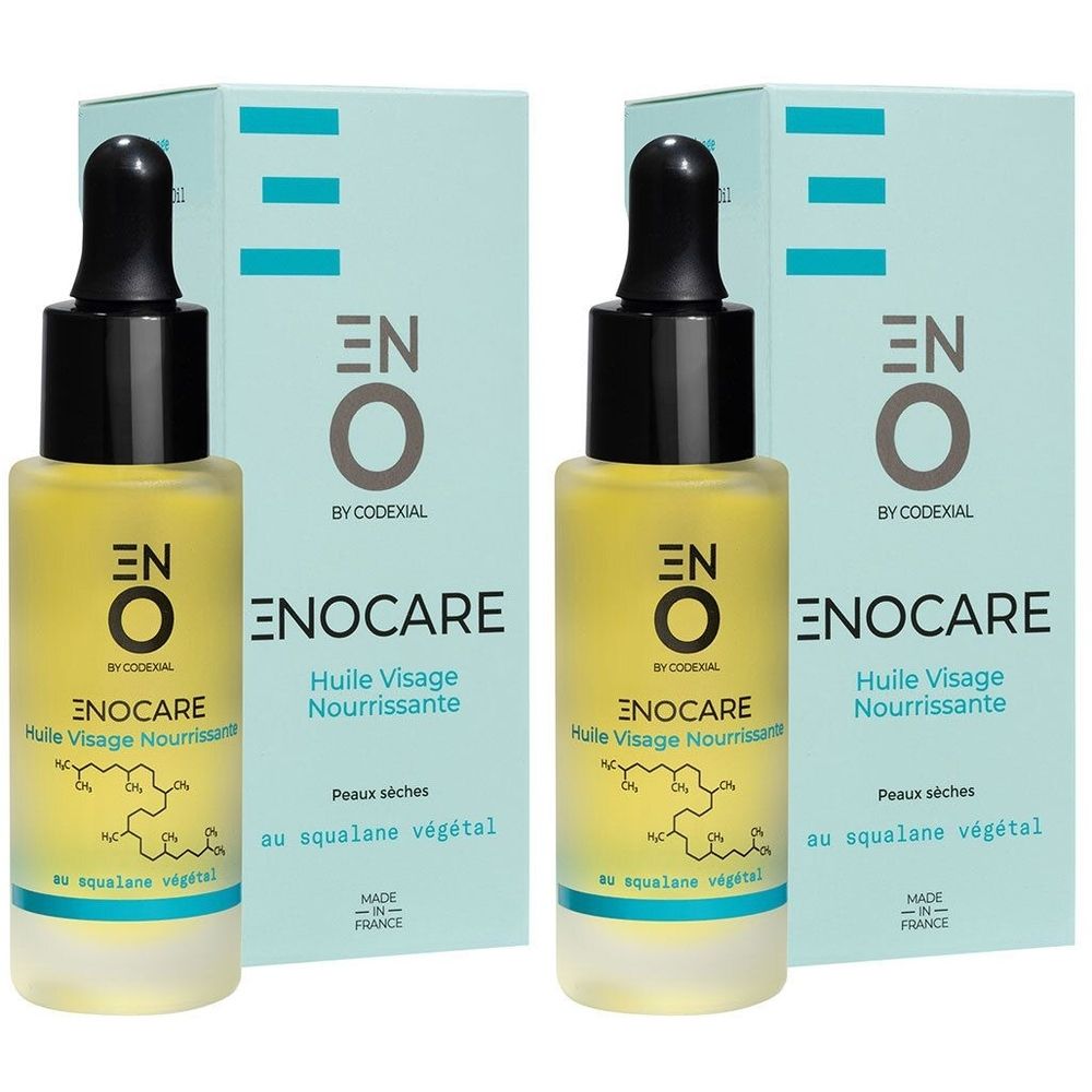Twee flessen gezichtsolie met zwarte dop en pipet. Opschrift: ENO Enocare, Huile Visage Nourrissante, voor de droge huid.