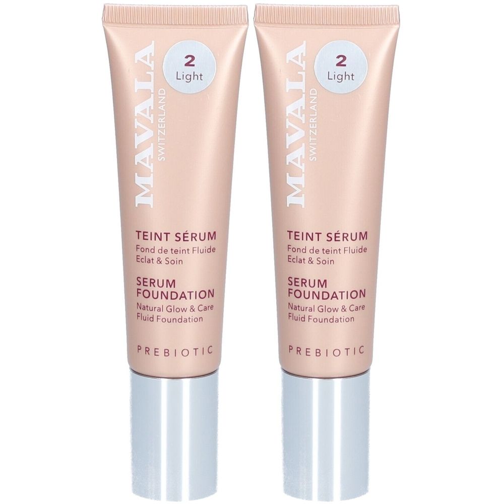Twee tubes Mavala Teint Serum Light. Lichtroze tubes met zilveren doppen. Tekst: Teint Serum, Serum Foundation, Prebiotic.