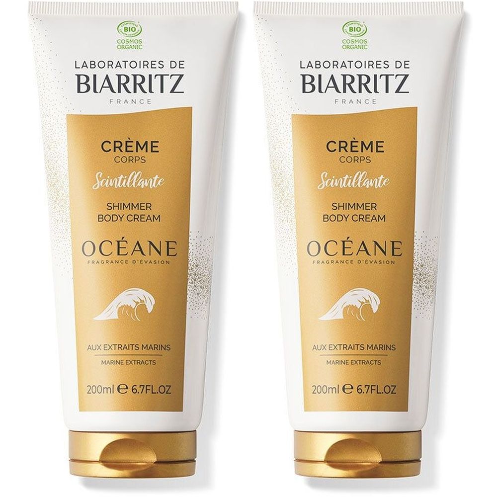 Deux tubes de crème. Emballage blanc et doré avec texte: Crème Corps Scintillante, Océane. 200ml. Label bio.