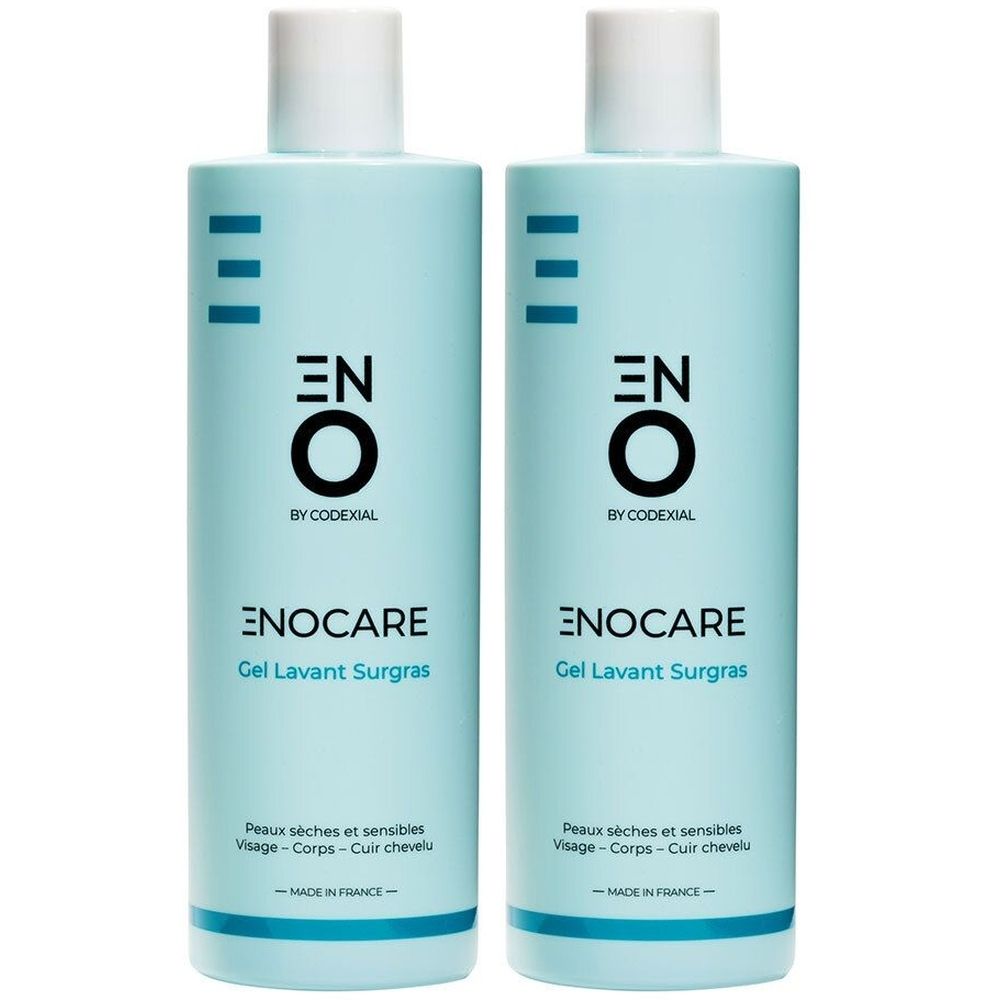 Twee lichtblauwe flessen met witte dop. Opschrift: ENO, ENOCARE, Gel Lavant Surgras. Voor de droge en gevoelige huid.
