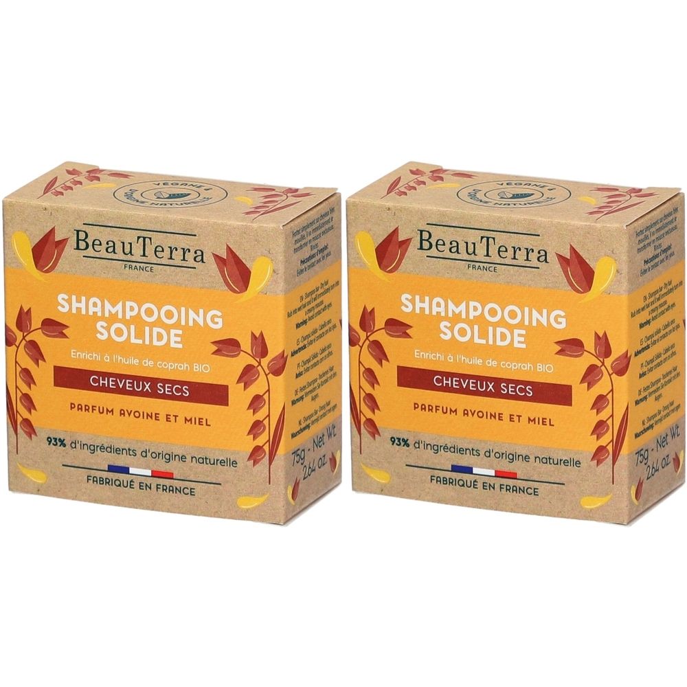 Deux boîtes rectangulaires. Inscription: BeauTerra, Shampoing Solide, Cheveux Secs, Parfum Avoine et Miel. 93% ingrédients d&#x27;origine naturelle. Fabriqué en France.