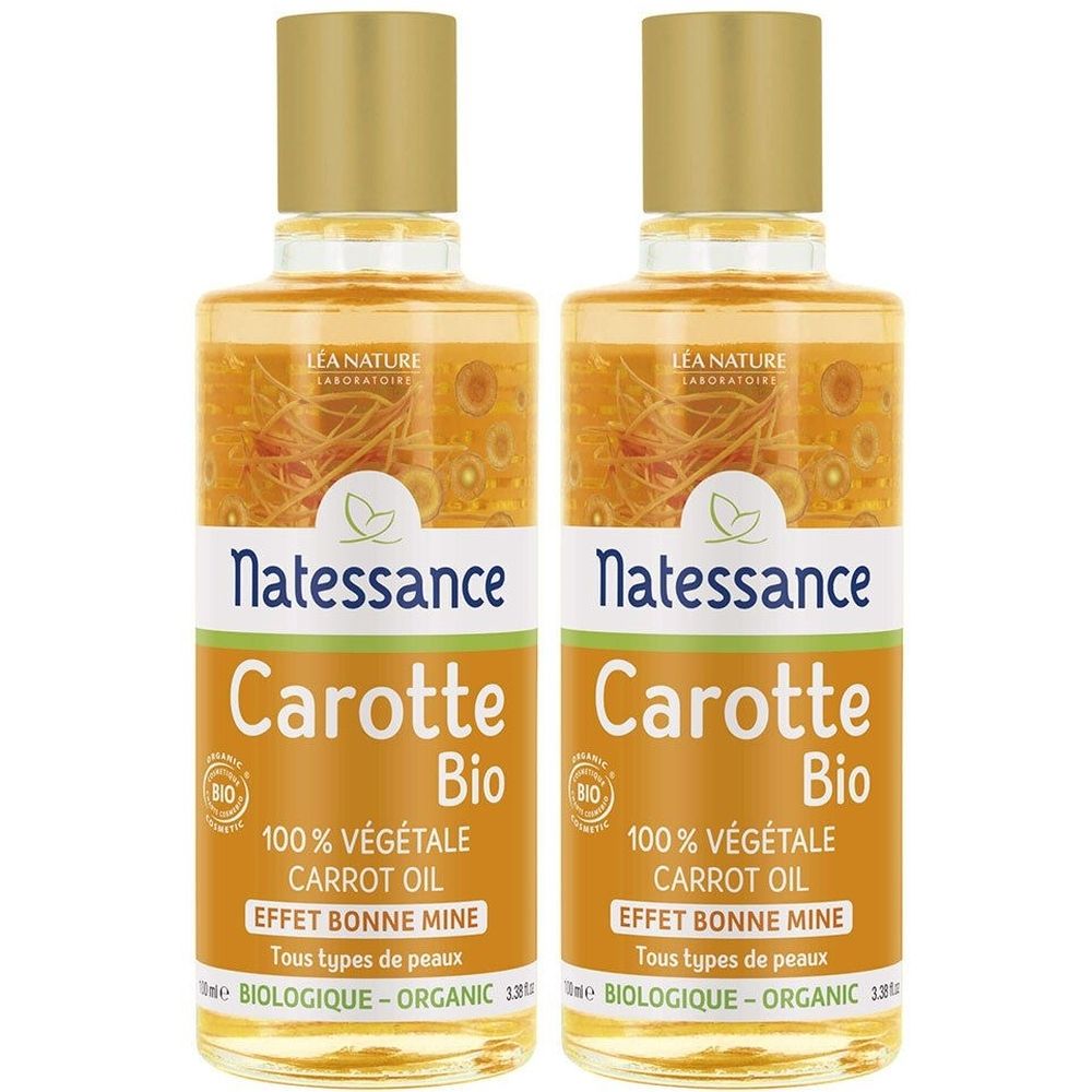 Twee flessen met gouden doppen. Opschrift: Natessance Carotte Bio, 100% Végétale Carrot Oil, Effet Bonne Mine, Tous types de peaux, Biologique-Organic.