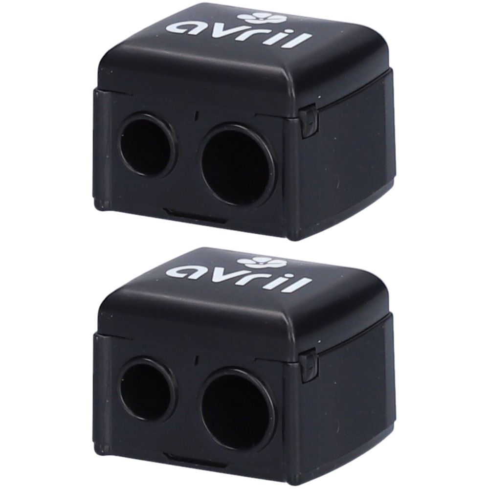 Deux taille-crayons noirs avec deux trous. Le mot "avril" est écrit en blanc sur le dessus.