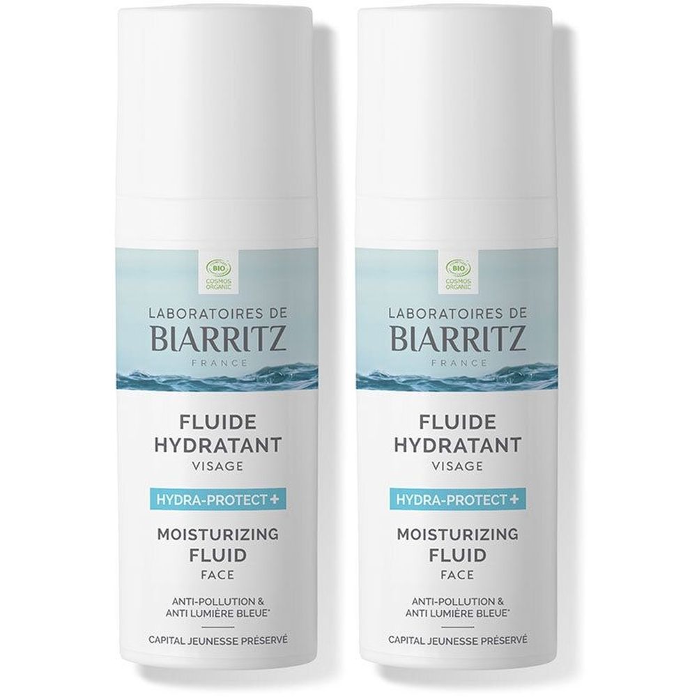 Twee witte flessen met etiketten. Opschrift: Laboratoires de Biarritz, Fluide Hydratant Visage, Hydra-Protect+.