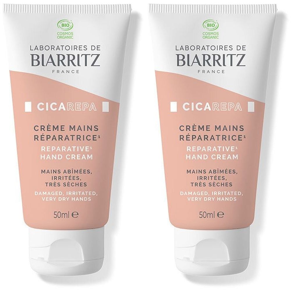 Deux tubes de crème pour les mains. Tubes blanc et rose avec texte: Laboratoires de Biarritz, Crème Mains Réparatrice, 50ml e. Label Bio.