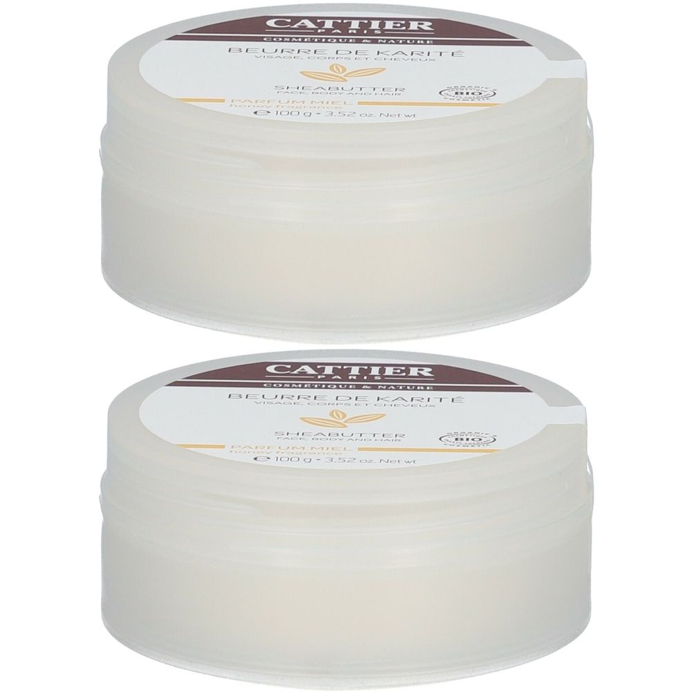 Twee crèmepotten met deksels. Opschrift: Cattier Paris, Beurre de Karité, Sheabutter. Biologische certificering.