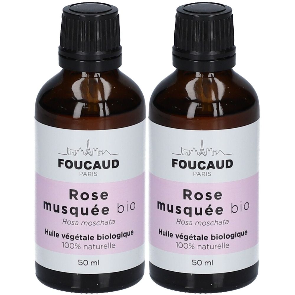 Twee flessen FOUCAUD Rose musquée bio. Bruine glazen flessen met zwarte dop en wit etiket met roze tekst. 50 ml.