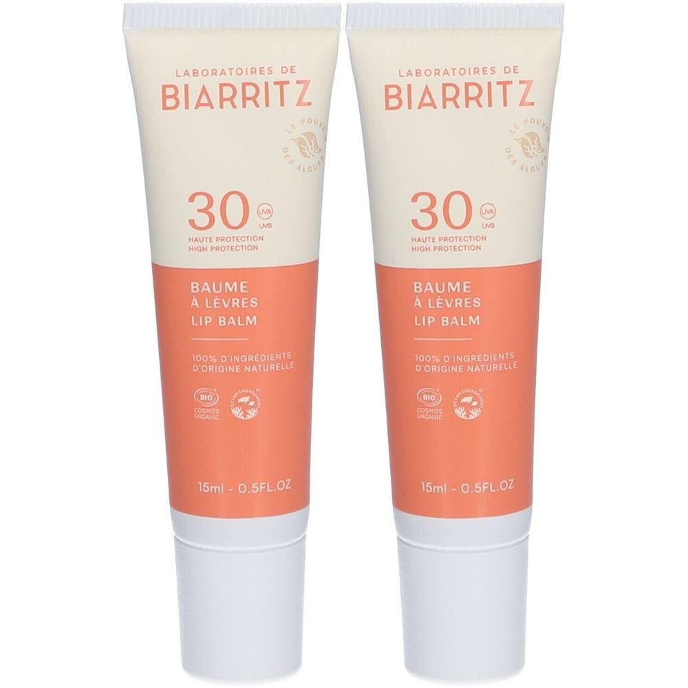 Twee tubes lippenbalsem. Wit-oranje verpakking met productnaam en SPF30. Bio-certificering.