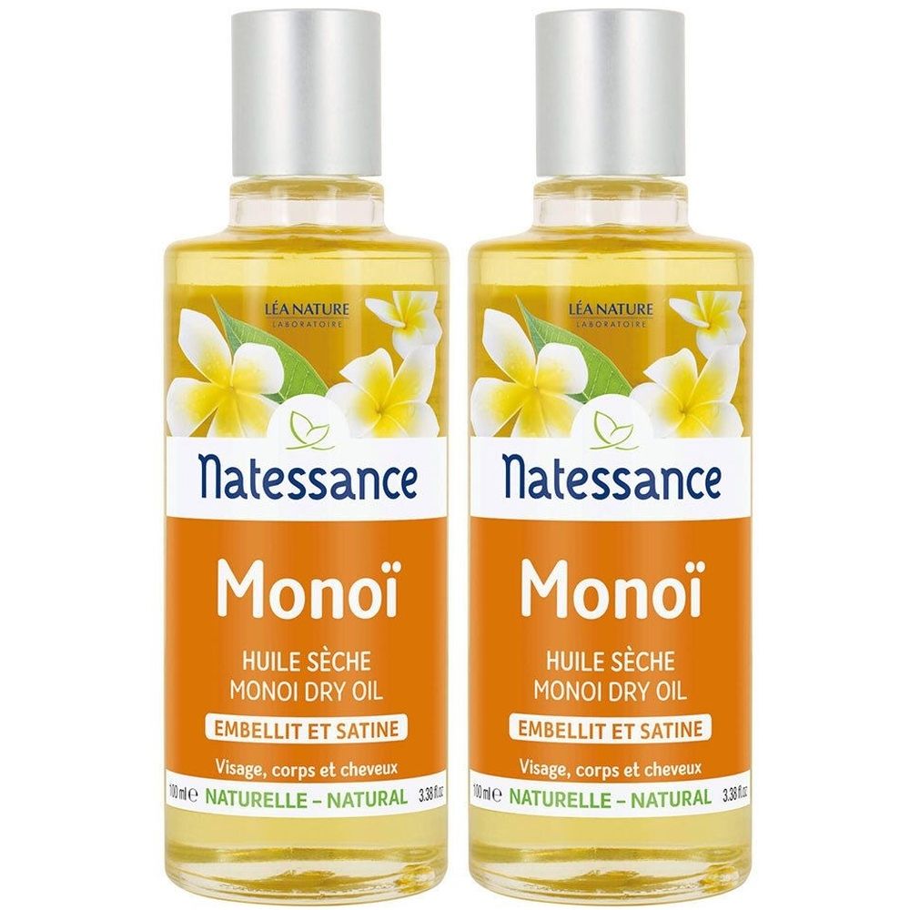 Twee flessen met gele vloeistof. Labels met "Natessance Monoï Huile Sèche". Zilveren doppen en bloemdecoratie. Tekst: "Visage, corps et cheveux".