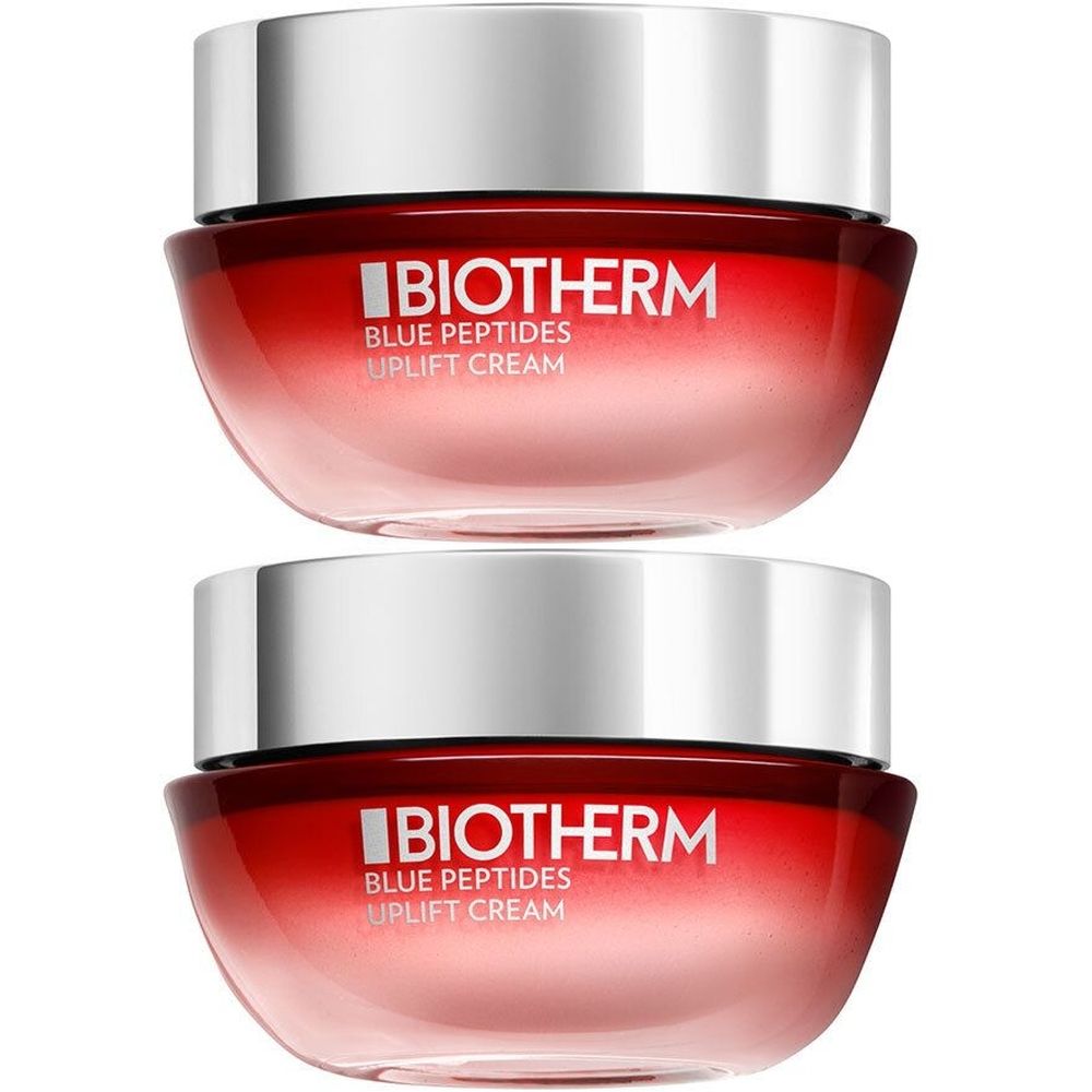 Twee potjes Biotherm Blue Peptides Uplift Cream. Rode pot met zilveren deksel. Witte belettering.