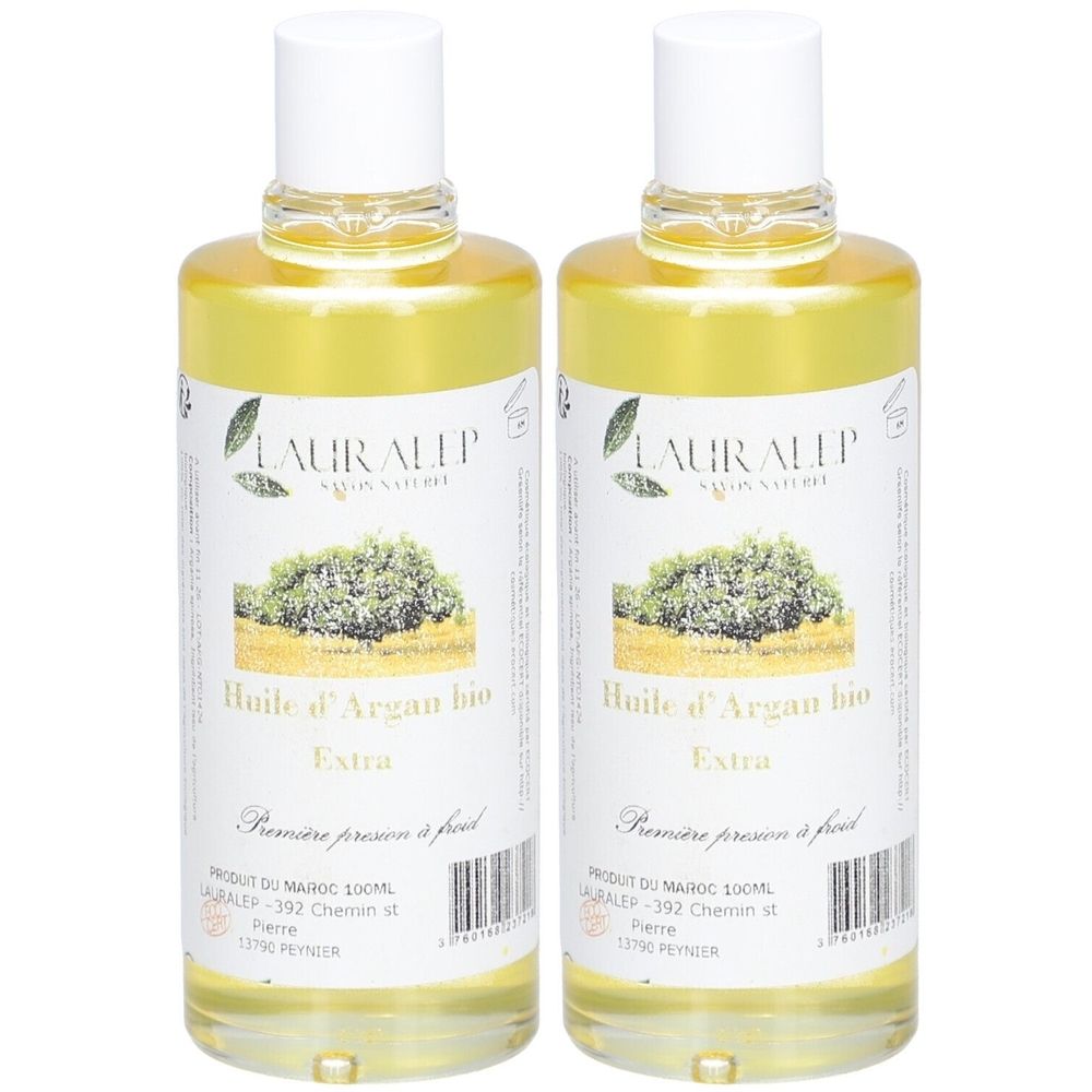Twee flessen gele olie. Labels met "Huile d'Argan bio Extra" en "LAURALEP". Witte doppen.