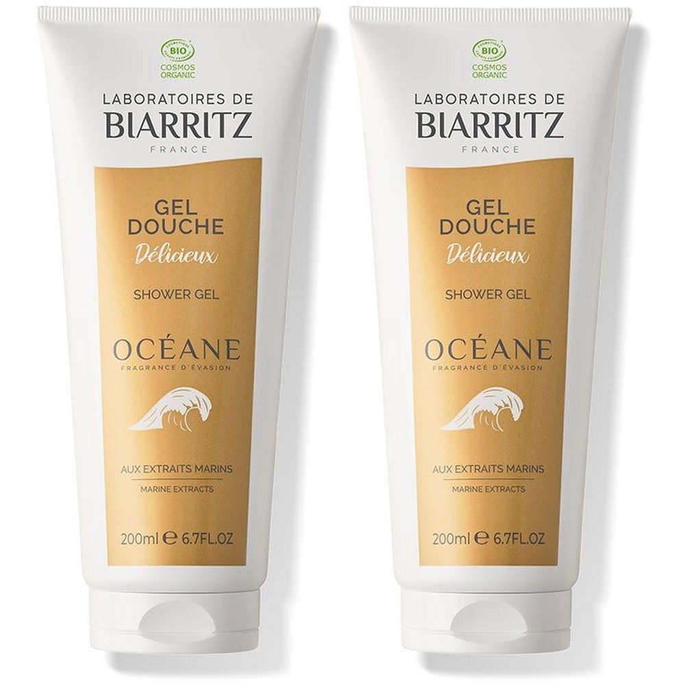Deux tubes de gel douche. Blancs, avec une section dorée. Inscriptions: Laboratoires de Biarritz, Gel Douche Délicieux, Océane. Avec label bio.