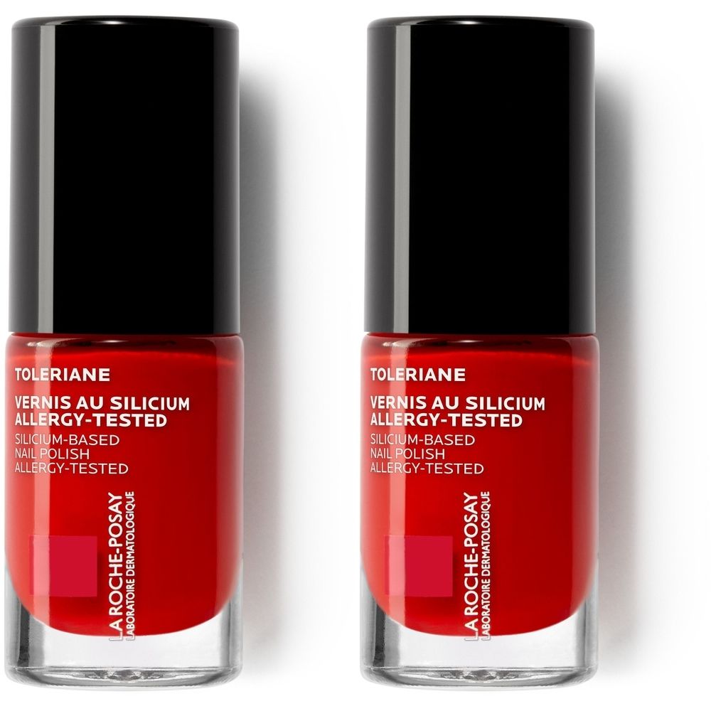 Twee rode nagellakflesjes met zwarte dop. Opschrift: Toleriane, Vernis au Silicium, Allergy-Tested. Merk: La Roche-Posay.