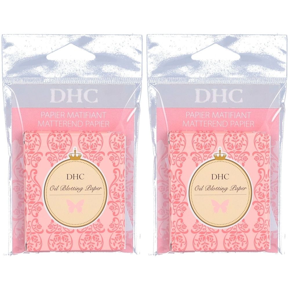 Deux paquets de papier matifiant. Chaque paquet contient du papier rose avec un motif floral et le logo DHC. Emballage plastique transparent.