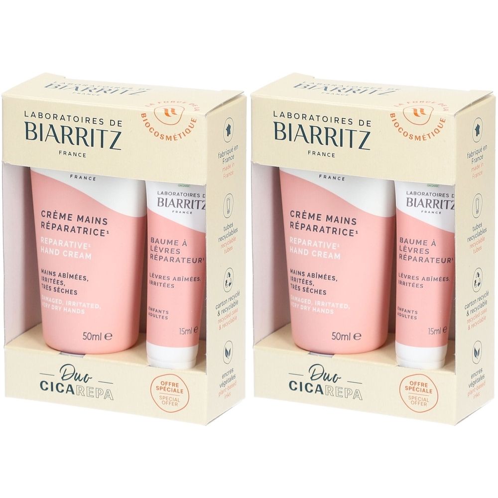 Twee productverpakkingen met handcrème en lippenbalsem. Roze tubes in dozen met productinfo.